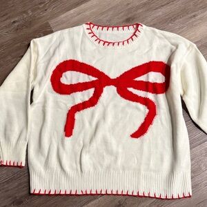 Elegant Cream Sweater with Red Bow Accent